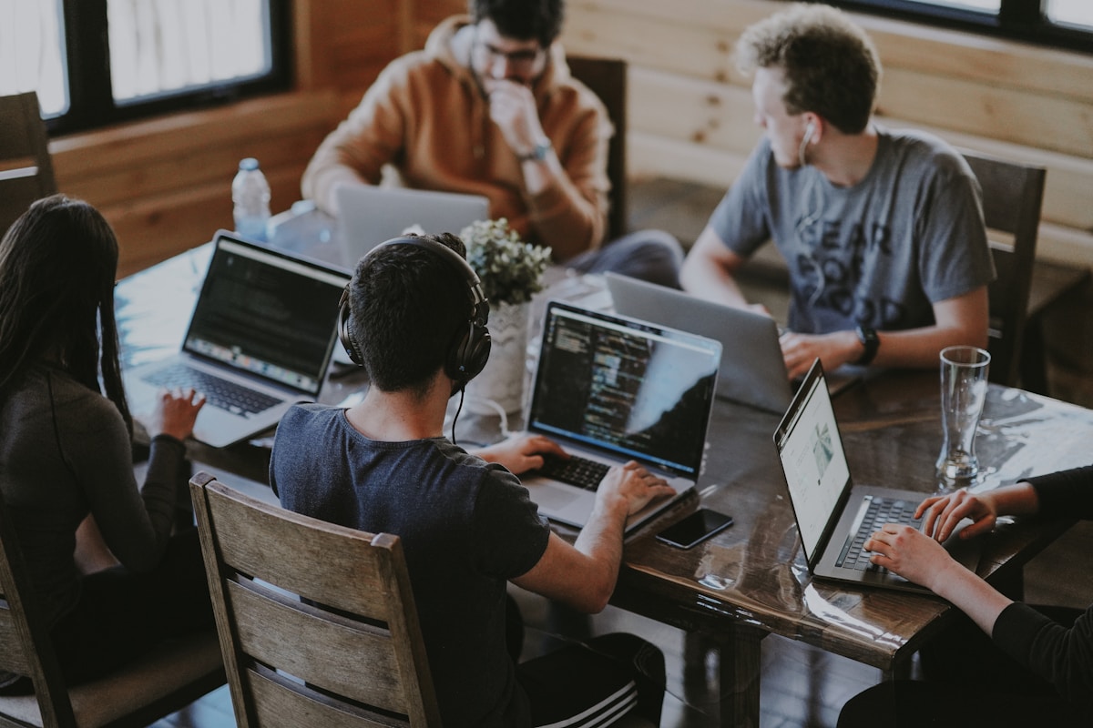Team of people working together in modern coworking space