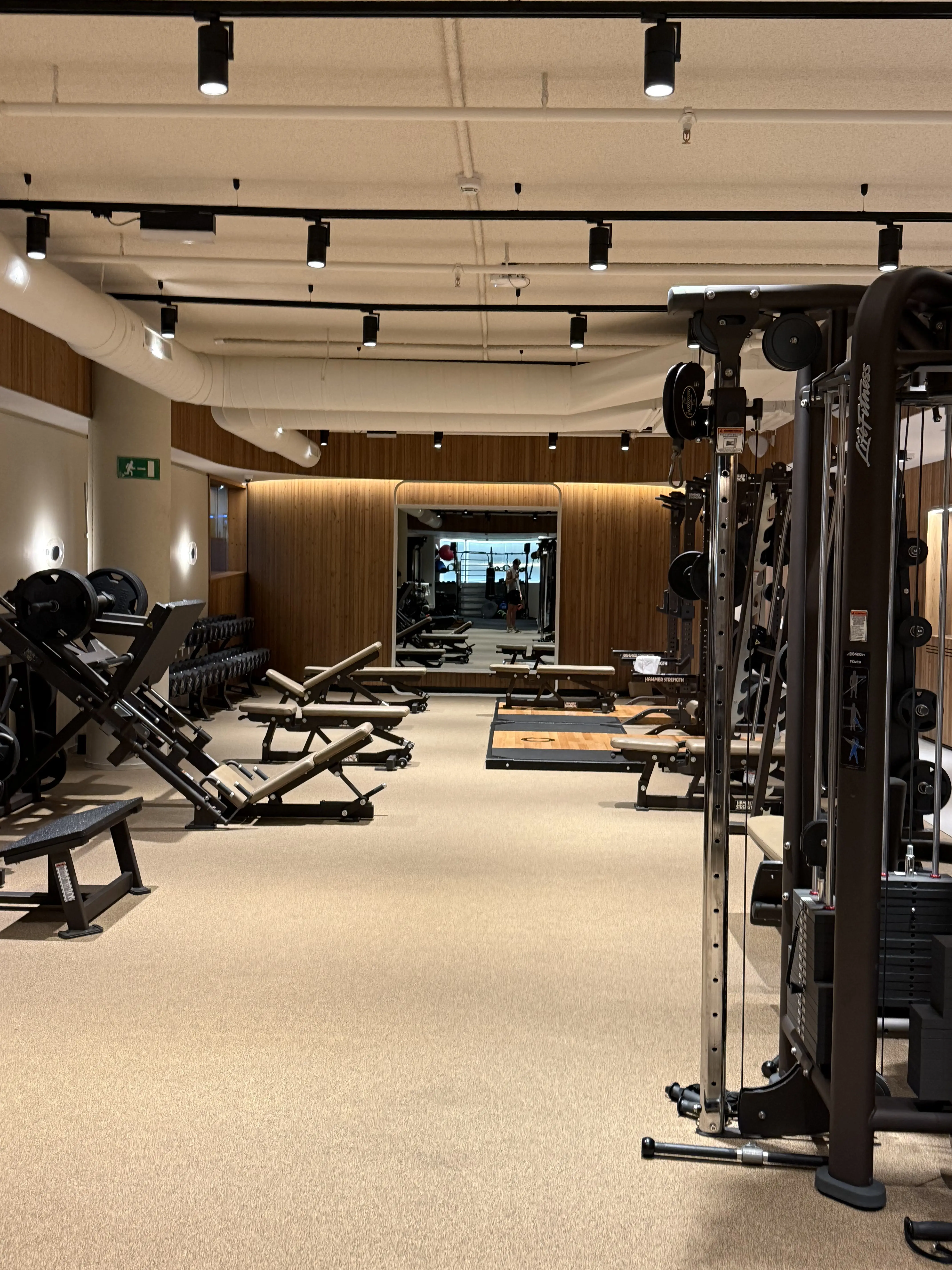 Inner Flow gym at Norrsken House Barcelona, Life Fitness equipment and warm wood interior