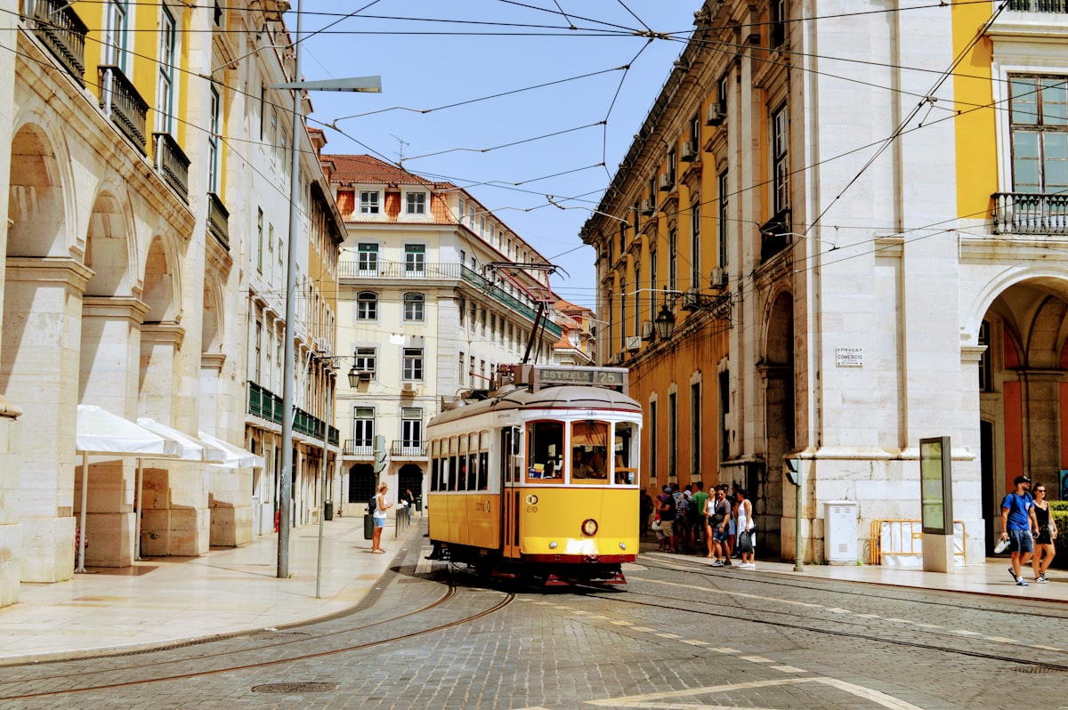 Lisbon yellow tram on a narrow street